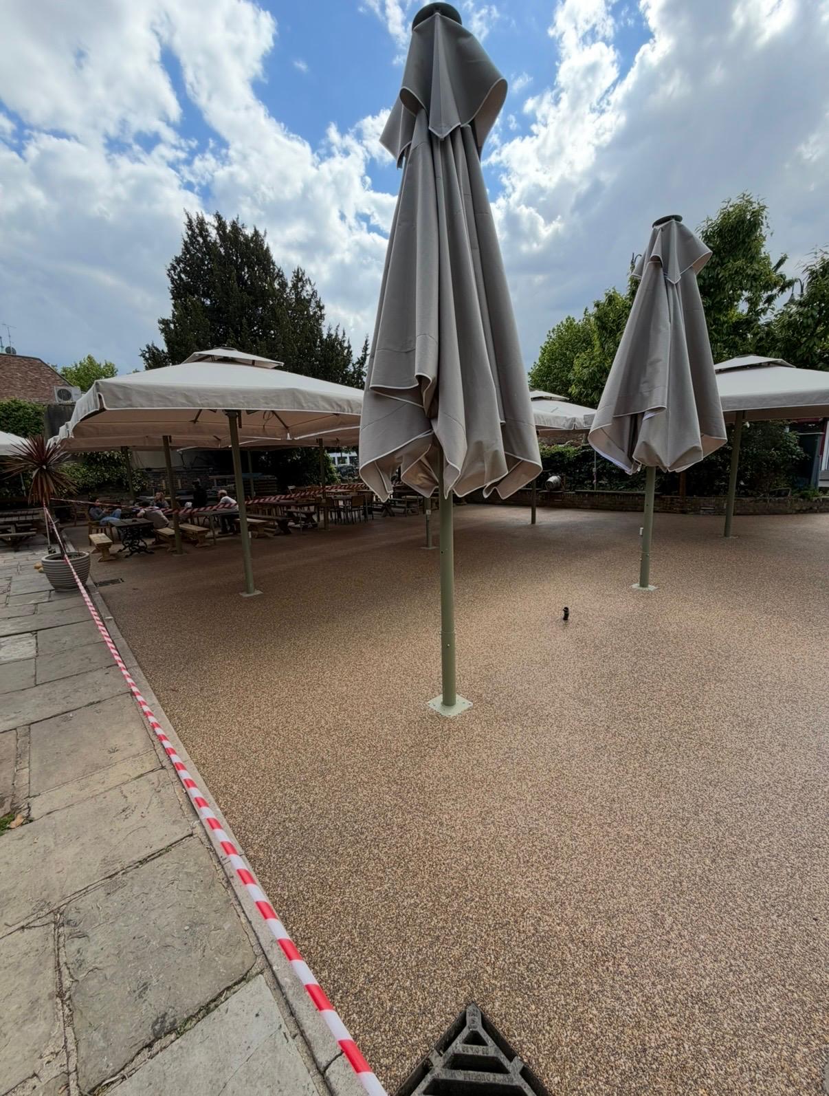 Newly laid resin surface across the pub garden