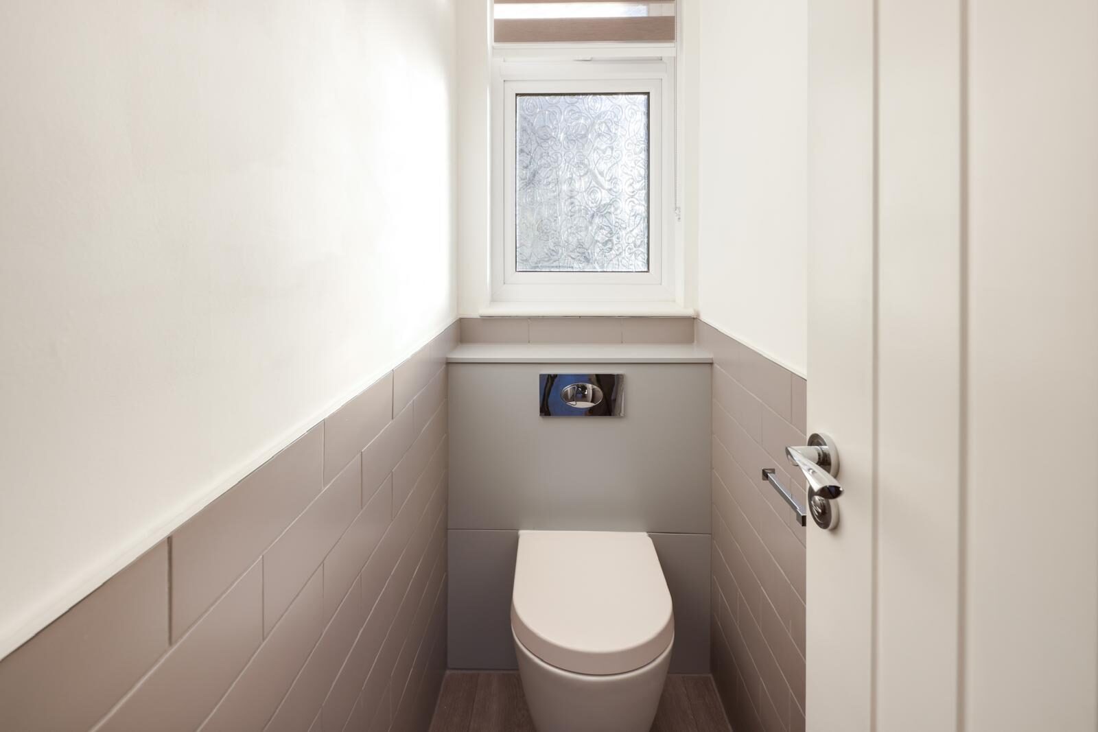Panelled cloakroom with wall-hung WC, London & Essex