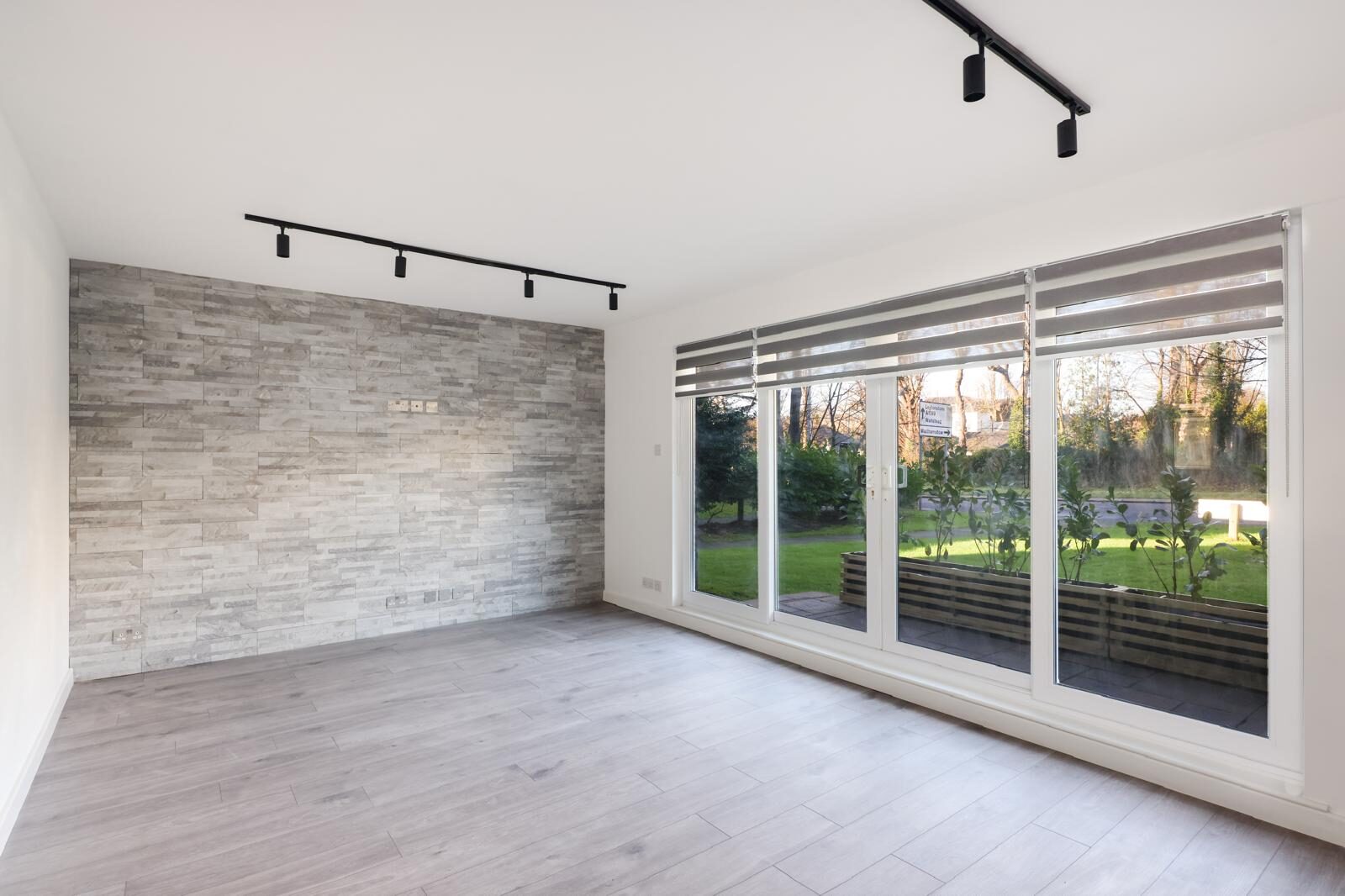 Living room with bifold doors and new flooring, London & Essex
